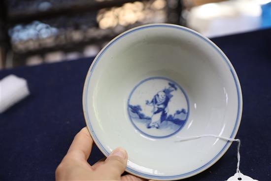 A Chinese blue and white immortals bowl, 18th century, D. 16.5cm, wood stand